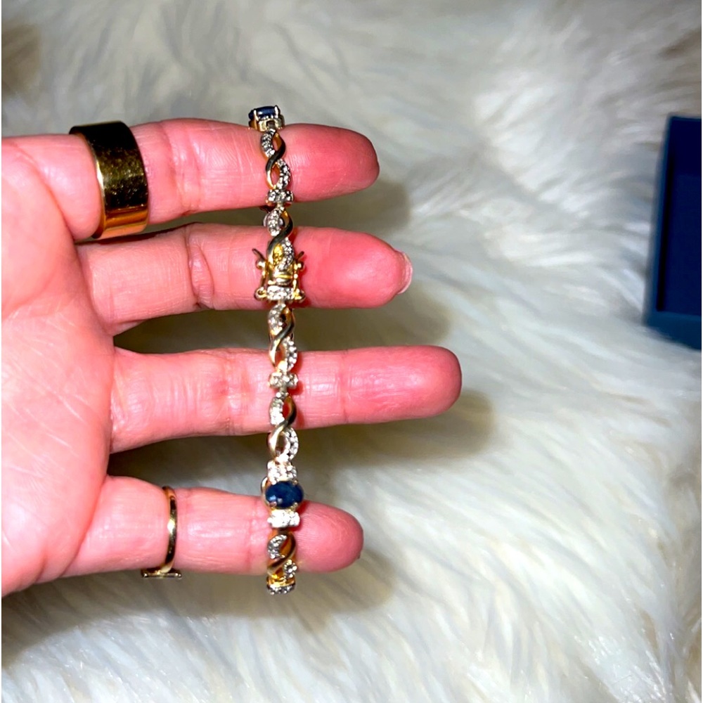 Yellow Gold Tone Infinity diamond accent with black diamond tone.